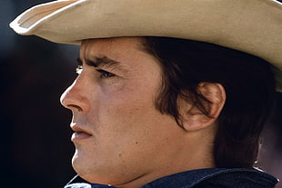 man wearing brown cowboy hat in close up photo