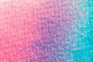 pink, purple, and teal textile