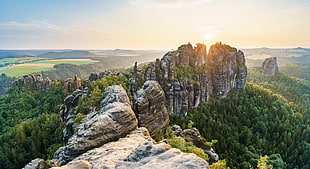 panorama photography of rock mountains surrounded by trees HD wallpaper