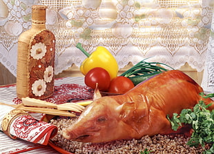 Roasted Pig beside spices on brown surface