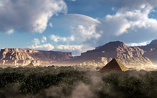 photography of Pyramid surrounded by mountains