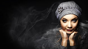 time lapse photography of woman wearing gray knit cap
