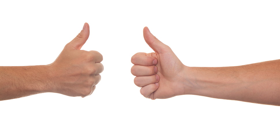 two person's hand doing thumbs up gestures HD wallpaper