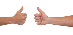 two person's hand doing thumbs up gestures HD wallpaper