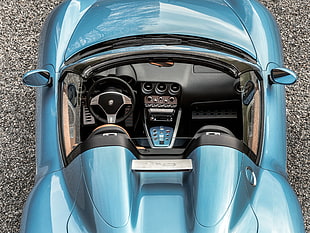 areal photo of blue convertible coupe