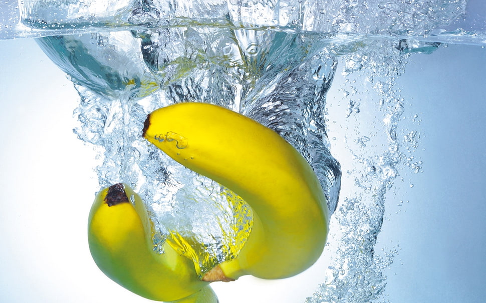 photography of two yellow bananas on body of water HD wallpaper