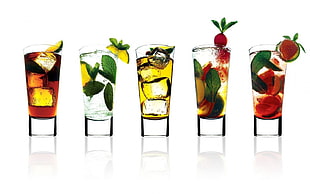 five cocktail glasses, cocktails, fruit, reflection, ice cubes