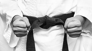 gray scale photo of a person wearing martial arts uniform