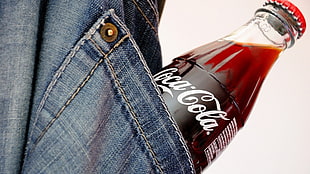 Coca-Cola glass bottle on pocket HD wallpaper