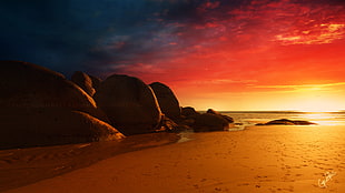brown rock formation near ocean water during orange sunset, beach, sand, sunset, sky