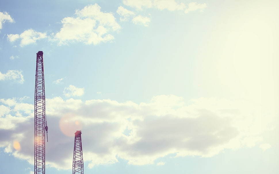 two red metal tall towers HD wallpaper