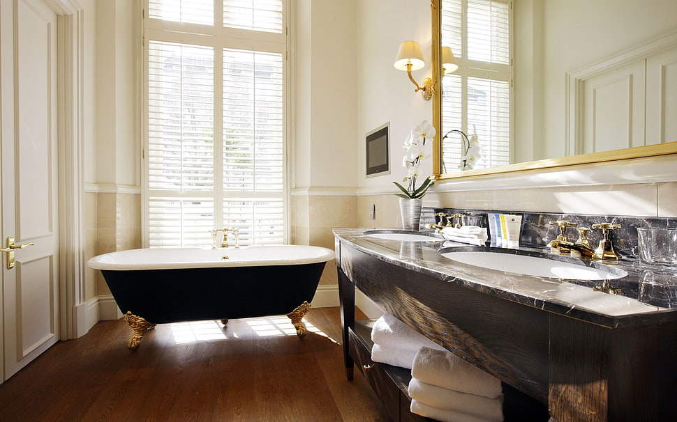 black and white ceramic bathtub near window inside the room HD wallpaper
