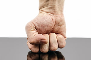 person showing right fist