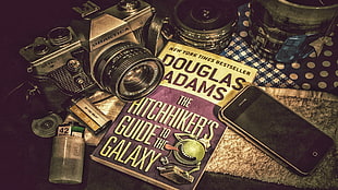 The Hitchhikers Guide To The Galaxy by Douglas Adams book, camera, smartphone, 3D desktop, journal