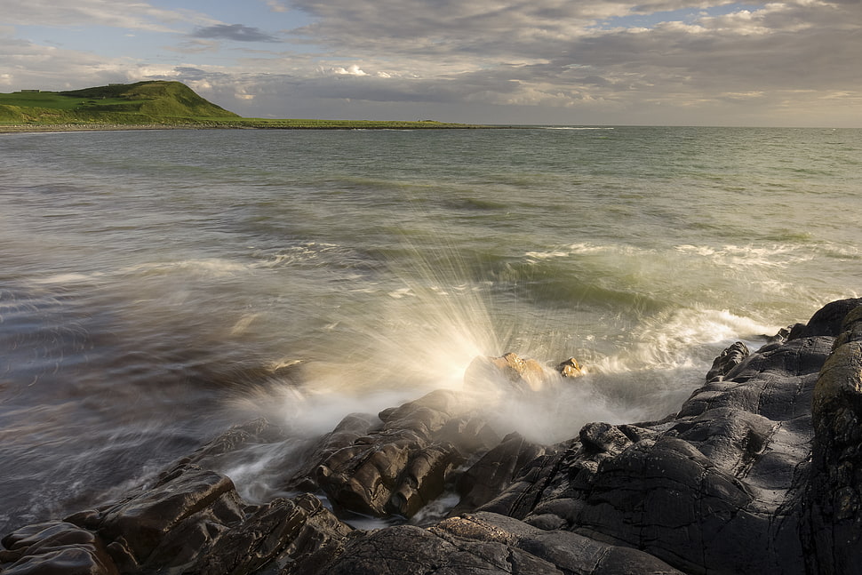 timelapse landscape photography of splash body of water beside rock formation, monreith HD wallpaper