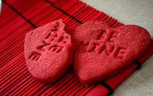 two red cookies on red mat