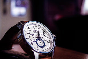 round silver-colored Invicta chronograph watch selective focus photo HD wallpaper