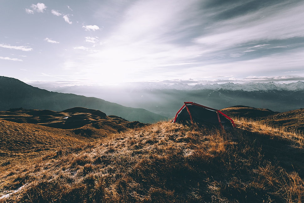 brown mountains near fogs at daytime HD wallpaper