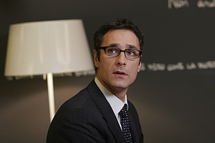 man in black suit near table lamp HD wallpaper