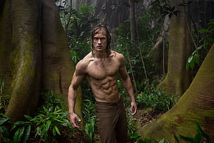 Tarzan movie character standing on forest