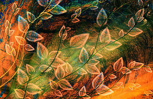 green, orange and black leaf-print textile