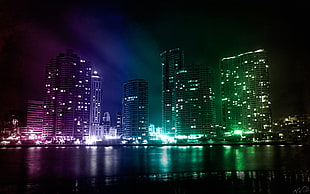turn on lights on high rise buildings at the city HD wallpaper