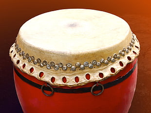 red, black, and white percussion instrument