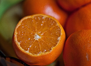 depth of field photography of sliced orange fruit
