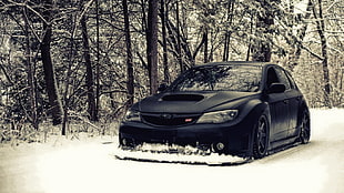 black Subaru WRX on snow HD wallpaper
