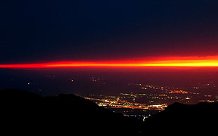 black and red LED light, city, mountains