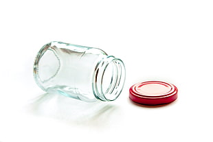 clear glass jar with red lid