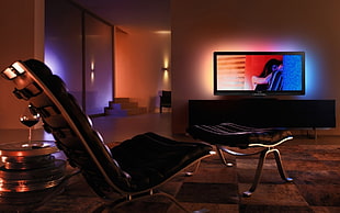 black framed gaming chair near ottoman HD wallpaper