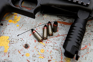 four brass-colored bullets, SR2MP  submachine gun