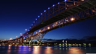 photo of suspension bridge with lights
