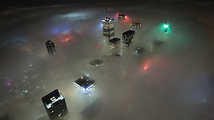 high-rise buildings, city, lights, skyline, mist