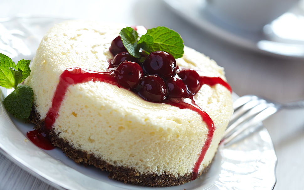 round cinnamon roll on white plate HD wallpaper