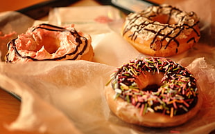 doughnuts with cream and sprinkles on top