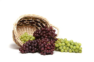 green and purple grape fruits on basket HD wallpaper