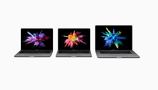 three gray-and-black laptops