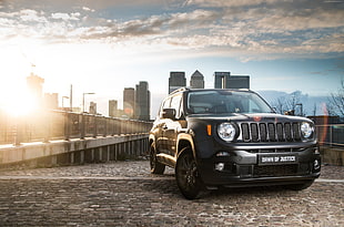 photo of Jeep compact SUV with high rise buildings during day time