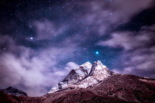 photo of rocky mountain under starry sky HD wallpaper