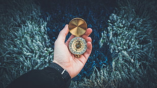 round gold-colored pocket compass HD wallpaper