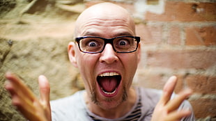 man wearing eyeglasses showing surprised expression HD wallpaper