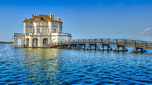 brown footbridge, pier, building, sea, water