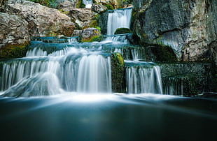 waterfalls in between of rock mountains