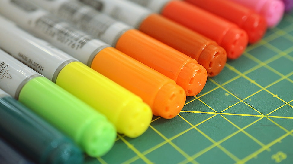 assorted-color markers on graphing board HD wallpaper