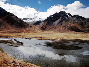 landscape photography of body of water near mountain HD wallpaper