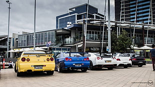 five assorted-color cars, Mitsubishi Lancer Evolution IX, Mitsubishi Lancer, Mitsubishi, Nissan Skyline GT-R R34