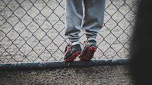 pair of black-and-red cleats