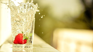 red strawberry in clear drinking glass HD wallpaper